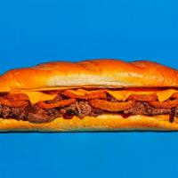 Bbq Cheesesteak · Sliced steak with melted cheddar, fried onion rings, and tangy BBQ sauce on a hoagie roll.