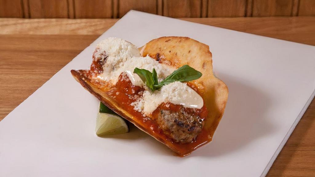 Meatball Parm · three meatballs, tomato sauce, melted cheese, parmigiano, basil