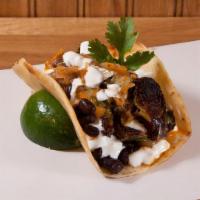 Beans & Brussels · roasted brussel sprouts, black beans, Tony's spicy red sauce, sour cream