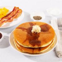 Pancake Combo · Two fluffy buttermilk pancakes served with maple syrup and powdered sugar, plus your choice ...