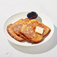 French Toast · Four slices of thick, egg-washed cinnamon bread served with maple syrup and powdered sugar.