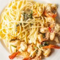 Shrimp Scampi · Served over Pasta.