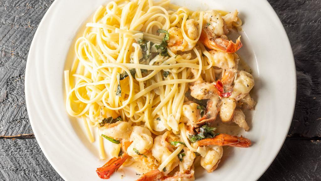 Shrimp Scampi · Served over Pasta.