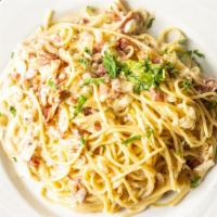 Spaghetti Carbonara · Spaghetti cooked in Butter Sauce, Egg, Prosciutto, Parmigiano Cheese.