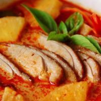 Duck Curry · Duck with tomatoes, pineapple, and mixed vegetables in a coconut red curry sauce.