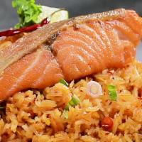 Salmon Fried Rice · Cooked Thai-style with egg, onions, scallions and carrots on top of grilled salmon.