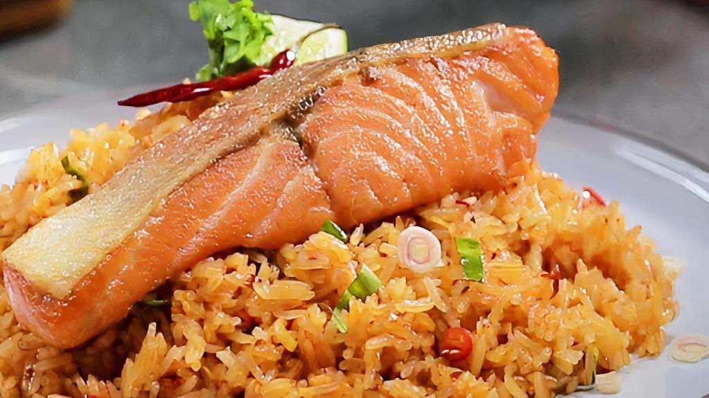 Salmon Fried Rice · Cooked Thai-style with egg, onions, scallions and carrots on top of grilled salmon.