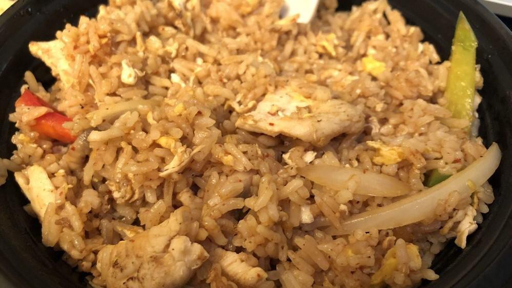 Tom Yum Fried Rice · Stir-fried rice with egg, onion, tom yam sauce, and mushroom