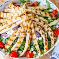 Arugula Salad With Grilled Chicken · arugula, grilled chicken, goat cheese, red onions, tomatoes.