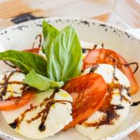 Caprese Salad · mozzarella, tomatoes, EVOO, fresh basil.
