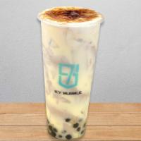 Fire Oolong Milk Tea · Oolong milk tea with boba, creamy cake on the wall and brulee sweet cheese foam on top