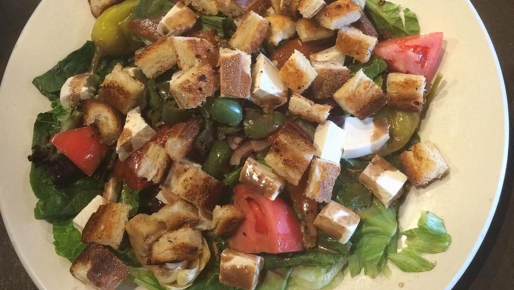Molinari Salad · Mixed greens, fresh mozz, roasted peppers, olives, artichoke hearts, tomato, red onion, grilled croutons with house dressing