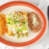 Flautas · Crispy rolled corn tortillas stuffed with beef or chicken and avocado sauce on the bottom. T...