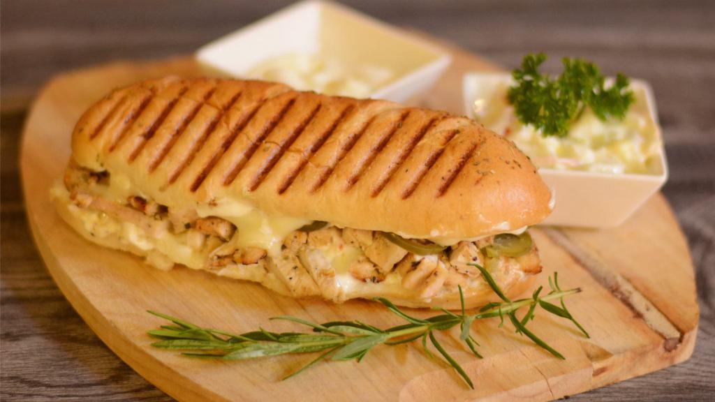 Italiano Panini · Grilled chicken, roasted peppers, fresh mozzarella cheese, and pesto sauce.