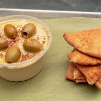 Hummus With Pita · A smooth blend of chickpeas, tahini and lemon, topped with olives and served with oven fresh...