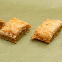 Baklava · A rich flaky Turkish pastry filled with nuts and topped with sweet syrupy goodness.