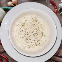 Classic Grandma Mashed Potatoes · Classic Idaho Potatoes Hand Smashed with Churned Butter, Sour Cream, and Milk.