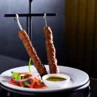 Lamb Seekh Kebab · Skewers of ground lamb mixed with a blend of spices, served with mint chutney.