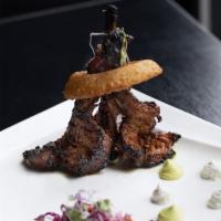 Aroqa Lamb Chop · Marinated in aRoqa’s blend of spices served with yogurt mint raita and topped with an onion ...