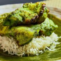 Basil Fish Tikka · Sole fish marinated in fresh basil and spices, served on a bed of white rice.