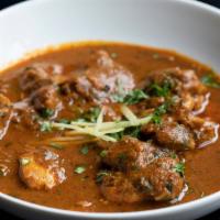 Lamb Curry · Home style lamb curry cooked in a blend of hand ground spices.