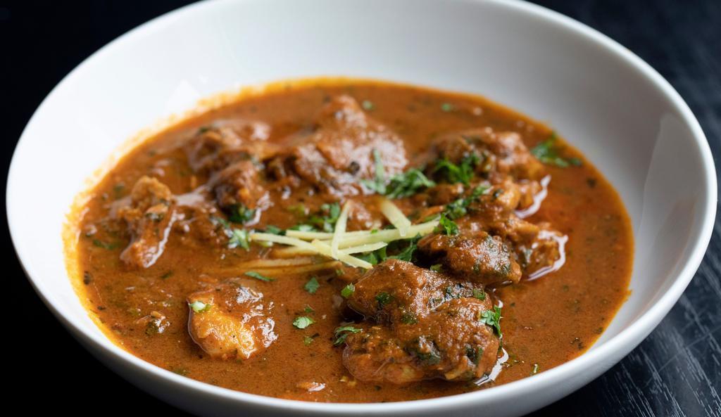 Lamb Curry · Home style lamb curry cooked in a blend of hand ground spices.