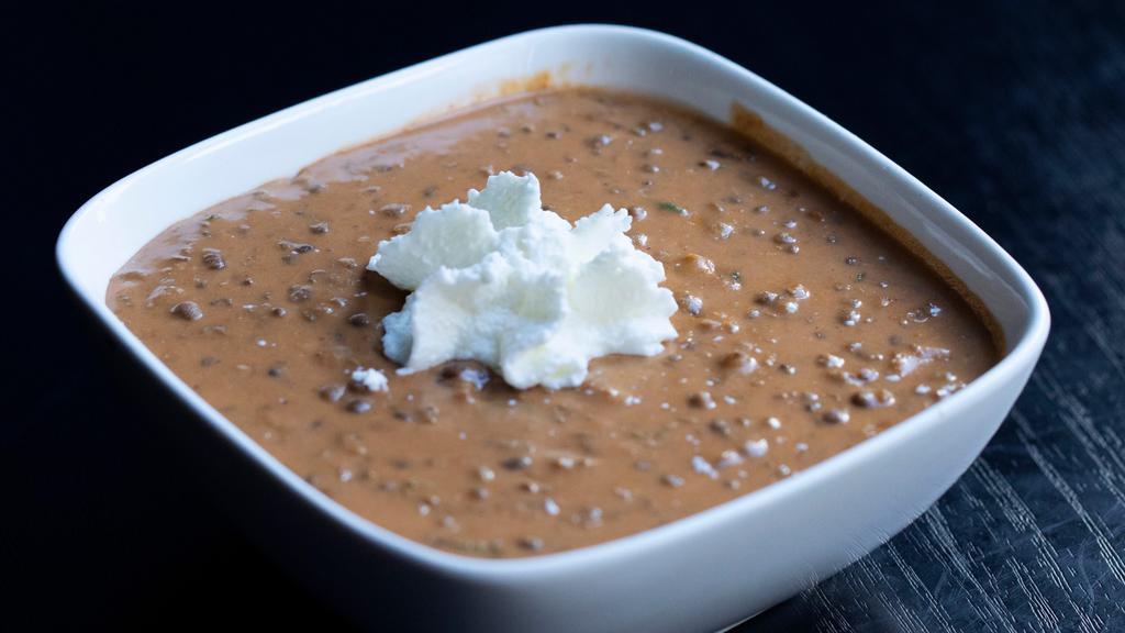 Dal Makhani · Medley of lentils with kidney beans slowly cooked with Indian spices.