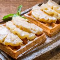 Chicken N Piña Colada Waffles · Fluffy waffle topped shredded pineapples and coconut, golden crispy chicken, syrup and butter.