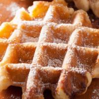 Powdered Sugar Waffles · Lightly crisp waffles with powdered sugar, syrup and butter on top.