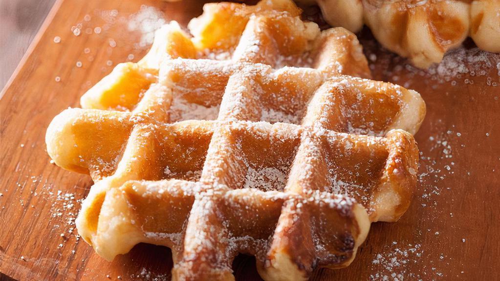Powdered Sugar Waffles · Lightly crisp waffles with powdered sugar, syrup and butter on top.