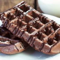Chocolate Waffles · Lightly crisp waffles with chocolate chips, syrup and butter on top.