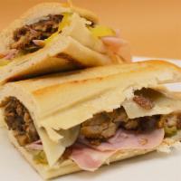 Cuban Sandwich · Served on hero. Roasted Pork, Ham, pickles, Swiss cheese and mustard.