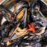 Steamed Mussels · Steamed mussels in coconut lemongrass broth.