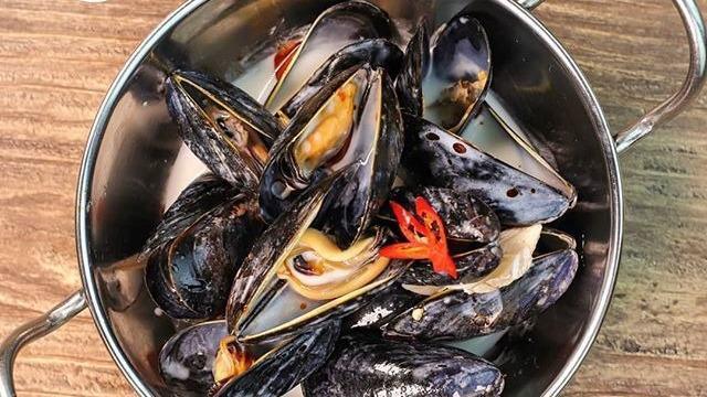 Steamed Mussels · Steamed mussels in coconut lemongrass broth.