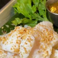 Steam Fish Fillet · Steam Fish Topped w/ Fried Garlic Chips.  Served w/ Spicy Ginger Sauce