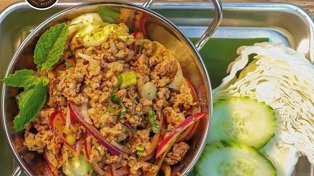 Spicy Thai Pork Salad(Larb) · Minced pork salad with shallot, lime juice, dried chili powder, fish sauce, roasted rice powder, scallion and cilantro. Mild spicy.
