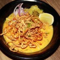 Khao Soi · Crispy egg noodle w/ mild yellow curry, scallions, red onions, bean sprouts and pickled must...