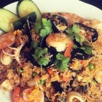 Seafood Fried Rice · Mix seafood shrimps, calamari, and mussels stir fry with house seafood sauce, egg, sweet pea...