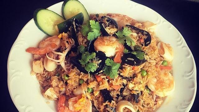 Seafood Fried Rice · Mix seafood shrimps, calamari, and mussels stir fry with house seafood sauce, egg, sweet pea, carrot, and thai jasmine rice.