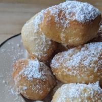 Zeppoles · Topped with Powdered Sugar.
