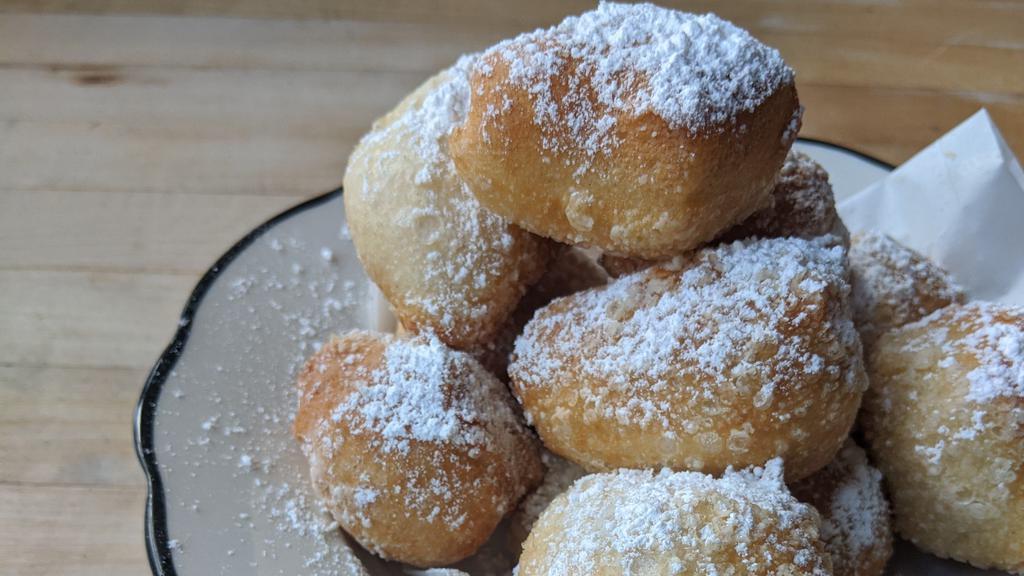 Zeppoles · Topped with Powdered Sugar.