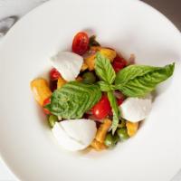 Panzanella · Cherry tomatoes, chopped basil, roasted peppers, red onions & Castelvetrano olives served ov...