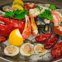 Seafood Plateau · oysters, clams,  crab claws,  mussels,  crawfish, and shrimp. Served with lemon, lime, cockt...