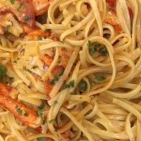 Lobster Pasta · Imported linguini pasta tossed with fresh herbs.