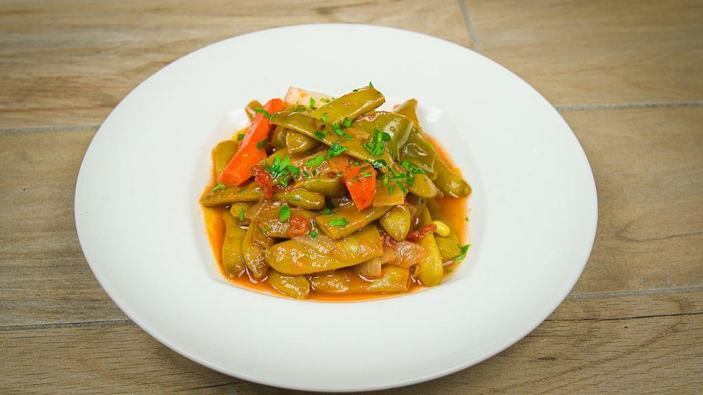 Roman Green Beans · Marinated with tomato and herb broth.