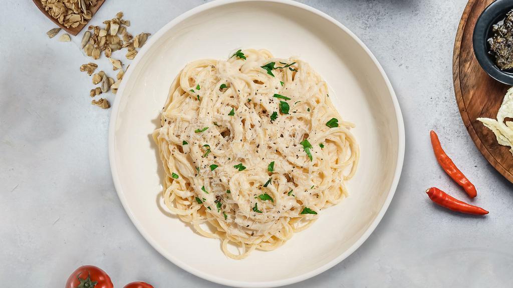 Classic Carbonara · Classic Italian pasta dish made with fresh spaghetti pasta, eggs, Parmigiano-Reggiano cheese, pancetta, and black pepper.