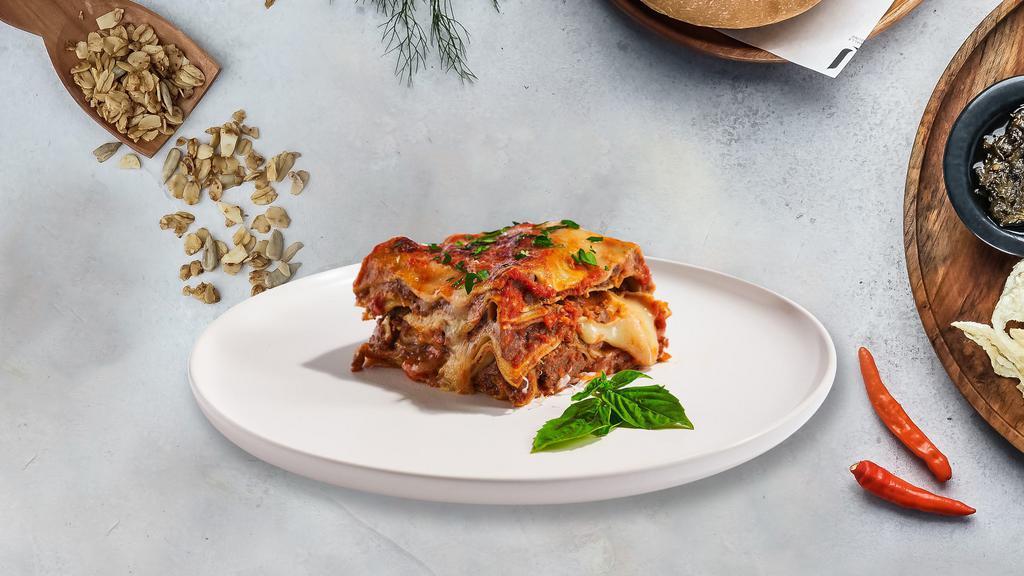 Lala Lasagna · Layers of pasta, ricotta, mozzarella, ground beef, and tomato sauce baked in an oven and topped with parmesan.