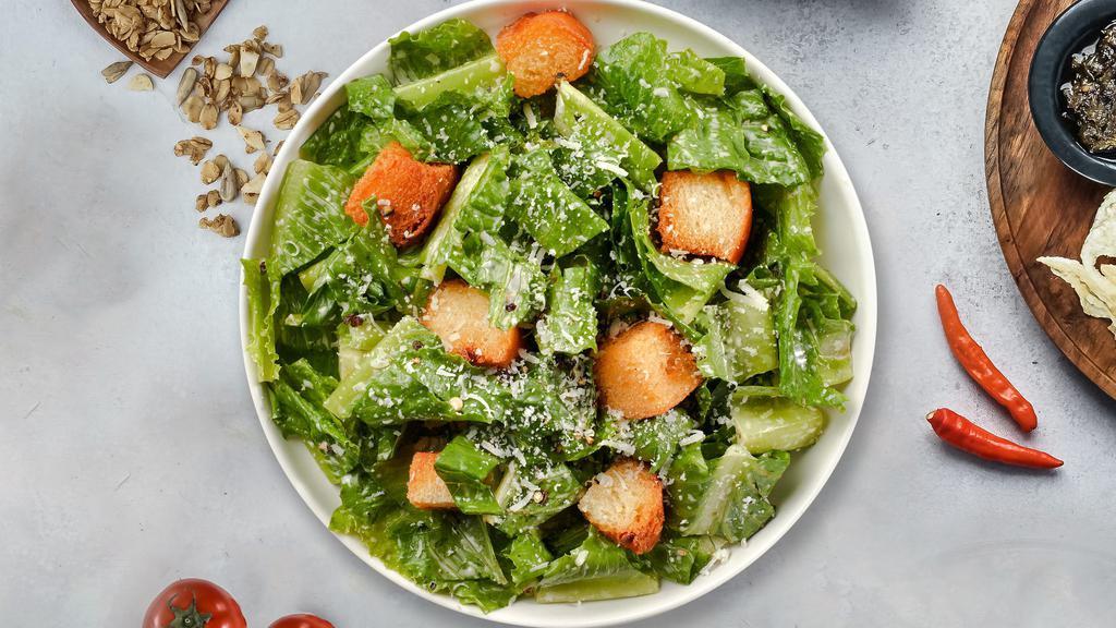 Crunchy Caesar Salad · (Vegetarian) Romaine lettuce, house croutons, and parmesan cheese tossed with Caesar dressing.