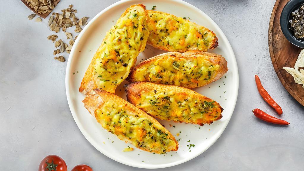 Garlic Bread With Cheese · (Vegetarian) Housemade bread toasted and garnished with butter, garlic, mozzarella cheese, and parsley.