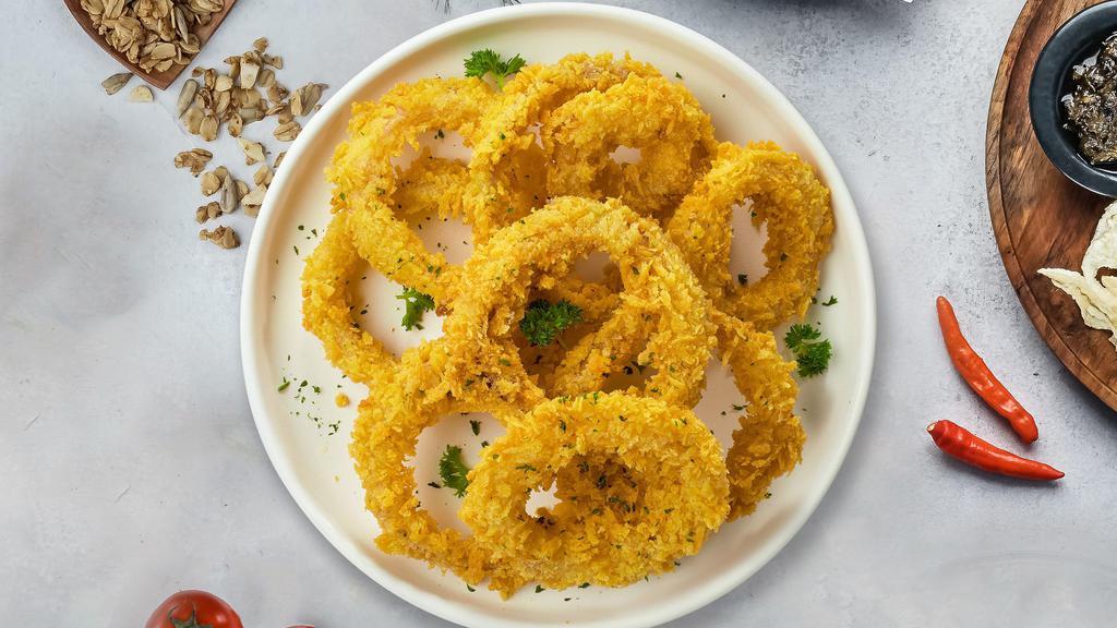 Onion Rings · (Vegetarian) Sliced onions dipped in a light batter and fried until crispy and golden brown.